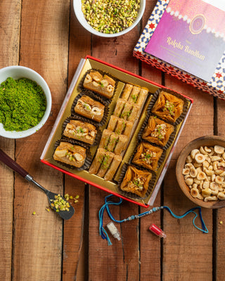 Rakhi Assorted Sweets Box 250g with 2 set of Kundan Rakhi & Rakhi Essentials