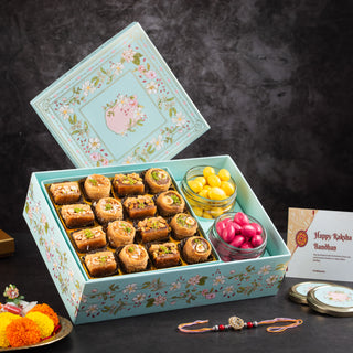 Rakhi Special – Assorted Sweets & Coated Dryfruit Box (With 2 Rakhis & Essentials)