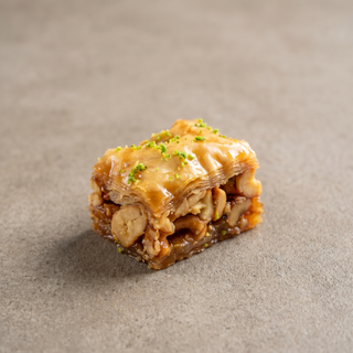 Cashew square baklava on a stone surface, premium gift sweet