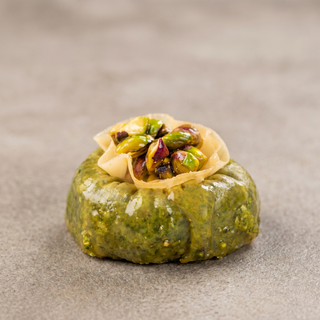 Pistachio Ring Baklava on a stone surface, premium gift