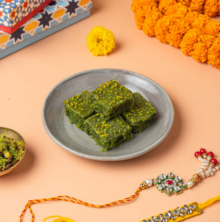 Pistachio Lauj with 2 set of Kundan Rakhi & Essentials